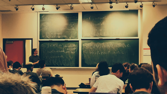 teacher in a classroom with students