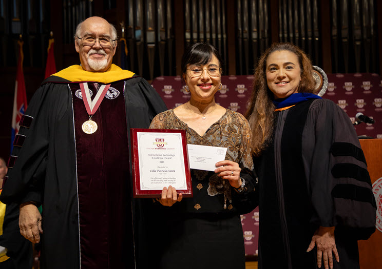 Instructional Technology Excellence Award Recipient, Prof. Lilia Cantu. Standing in between Dr. Pablo Arenaz and Dr. San Miguel.