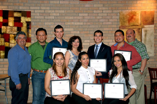 Left to right standing, back: past Alumni Association president Fernando Morales, treasurer J. J. González, TAMIU student Baruc Estrada Castillo, current Association president Mary Martínez, TAMIU students Rafael Contreras and José Antonio Gutíerrez, and Association vice president Mike Cortez. Left to right, seated are TAMIU students Rebecca Baca, Mónica Aguilar, and Jessica Nava.