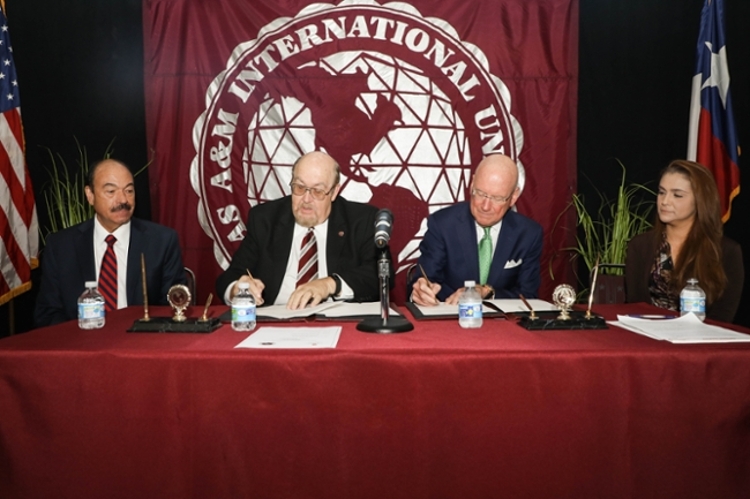 UT Health San Antonio officials join TAMIU counterparts to sign an historic agreement for health professions education.  Left to right, 