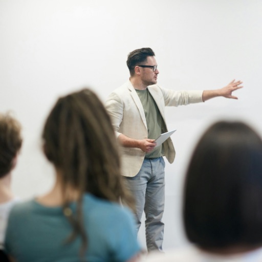 Speaker speaking in front of an audience